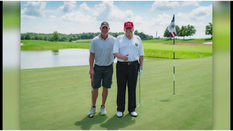 President Donald Trump and Brett Favre play golf