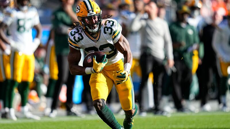Green Bay Packers running back Aaron Jones (33) runs against the Denver Broncos during the...
