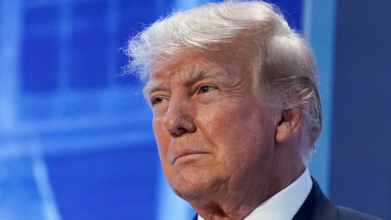 FILE - Former President Donald Trump arrives to speak at the Moms for Liberty meeting in...