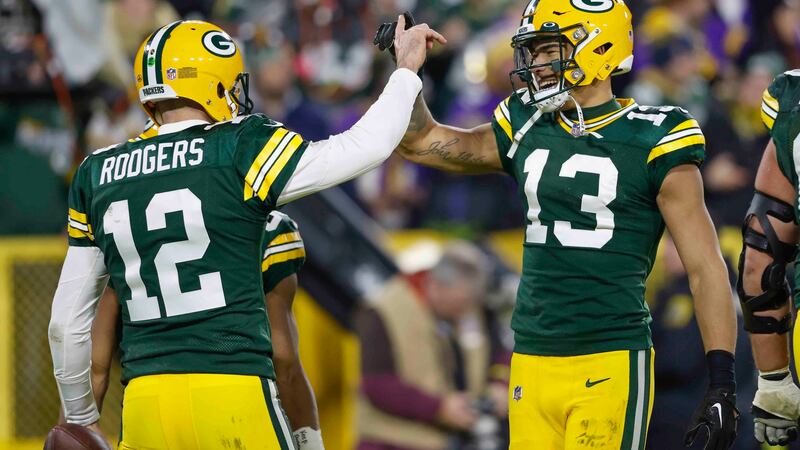 Green Bay Packers quarterback Aaron Rodgers (12) reacts with Green Bay Packers wide receiver...