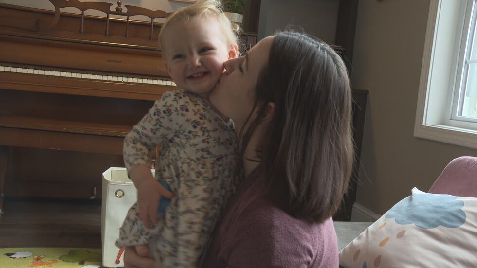 Kelly Hammond kisses her youngest daughter, Jane, as they play in their home in Stevens Point....