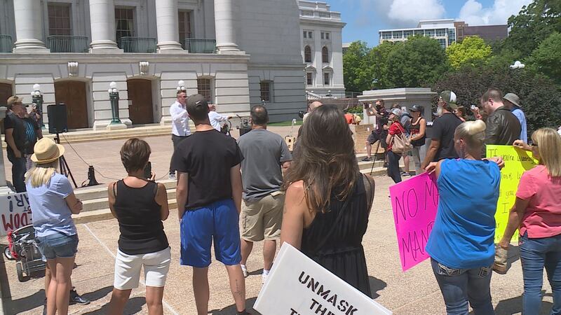 Dozens of protestors gathered below Gov. Evers's office as they send their message