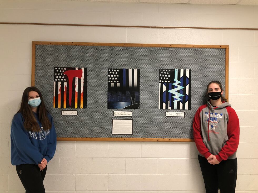 Lauren Bird (right) and Skylar Linde (left) pose in front of Bird's pieces after the two had...