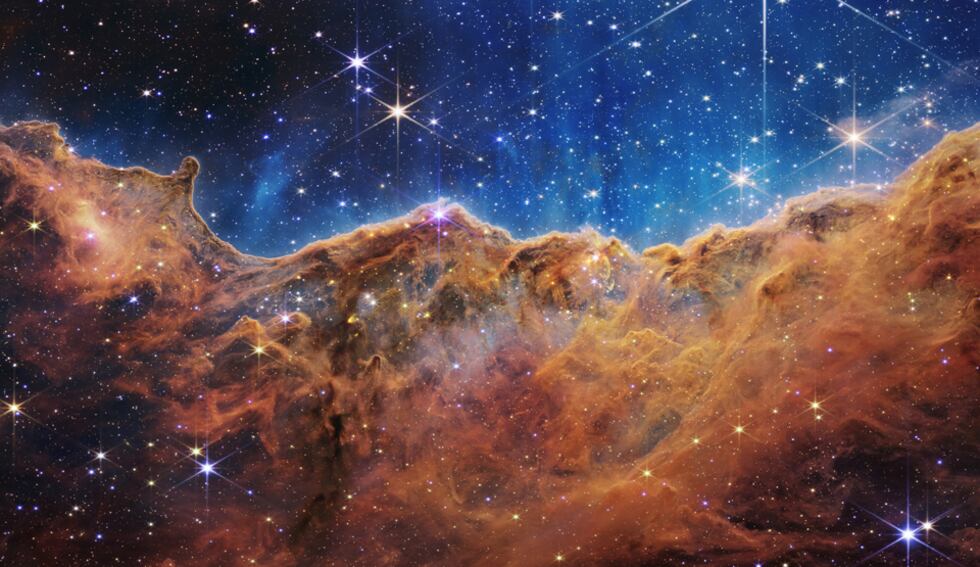 This landscape of “mountains” and “valleys” speckled with glittering stars is actually the...