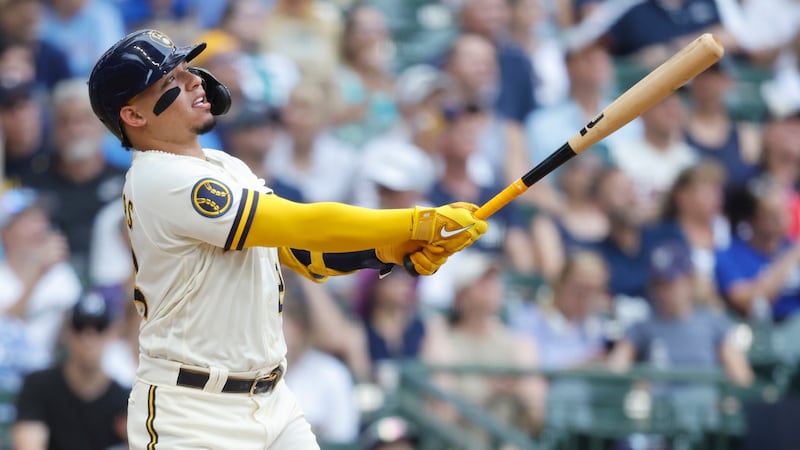 Milwaukee Brewers' William Contreras watches his home run against the Minnesota Twins during...