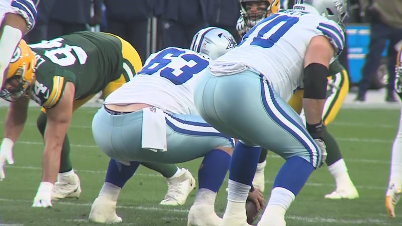 Cowboys center Tyler Biadasz under center as the Amherst native plays against the Green Bay...