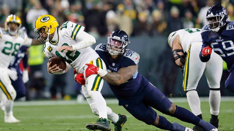 Tennessee Titans defensive tackle Jeffery Simmons (98) sacks Green Bay Packers quarterback...