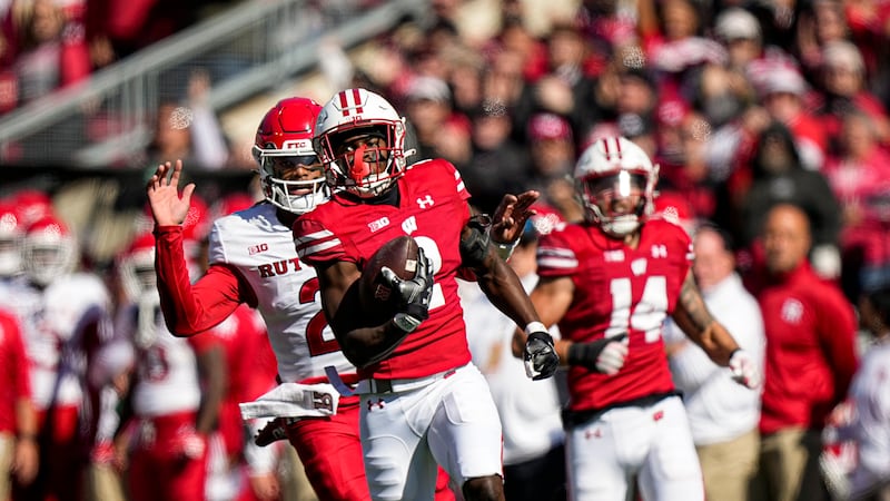 Wisconsin cornerback Ricardo Hallman (2) returns an interception 95-yards for touchdown as...