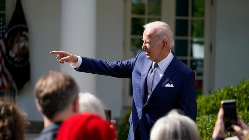 President Joe Biden talks to people after speaking during an event on health care costs, in...