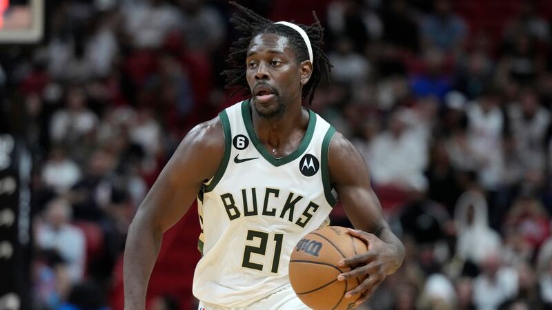 Milwaukee Bucks guard Jrue Holiday takes the ball down the court during the second half of an...
