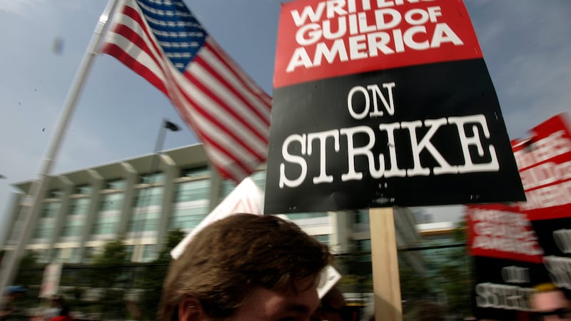 Writers Guild of America (WGA) writers and others strike against the Alliance of Motion...