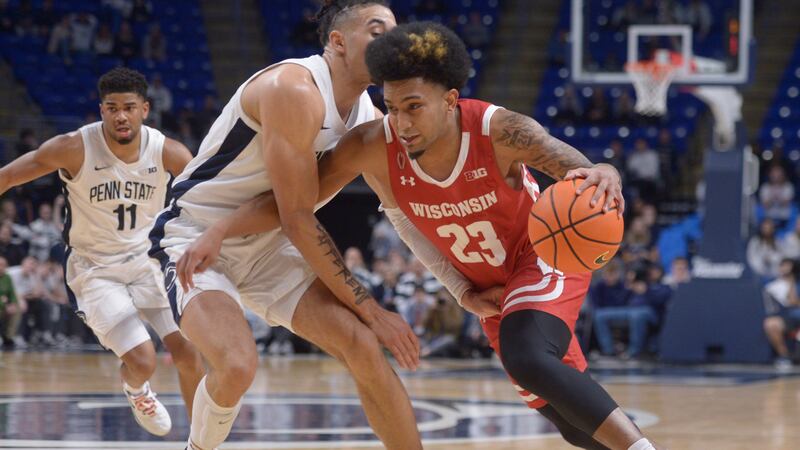 Wisconsin's Chucky Hepburn (23) drives the baseline on Penn State's Seth Lundy (1) during the...